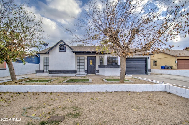 ranch-style home featuring a garage