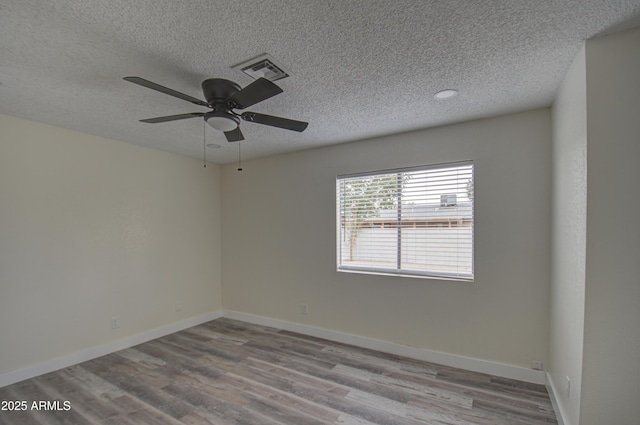 unfurnished room with light wood-type flooring, a textured ceiling, and ceiling fan