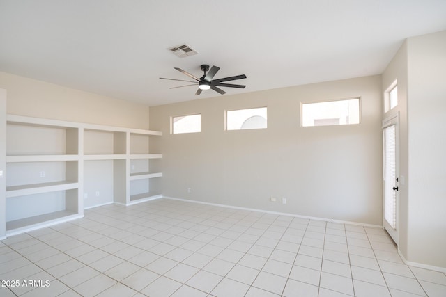 interior space with built in features and ceiling fan