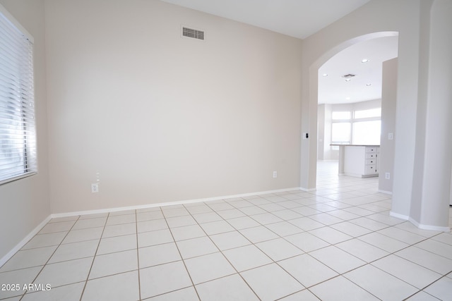 empty room featuring light tile patterned floors