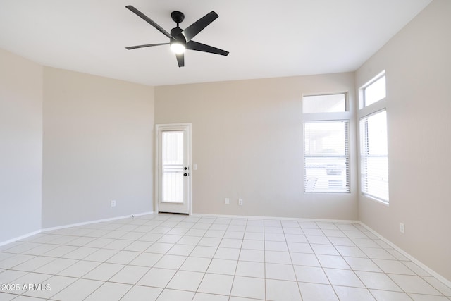 empty room featuring light tile patterned floors and ceiling fan