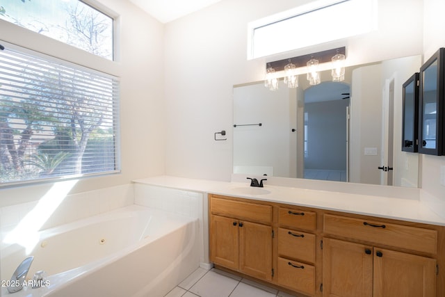 bathroom featuring vanity, a bathtub, and tile patterned floors