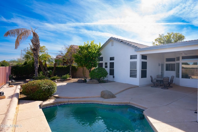 view of swimming pool with a patio area