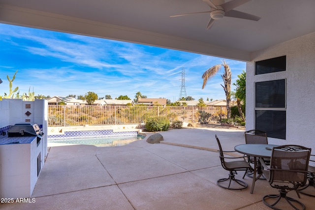 view of patio / terrace featuring area for grilling, a fenced in pool, and ceiling fan