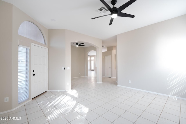 tiled foyer entrance featuring ceiling fan