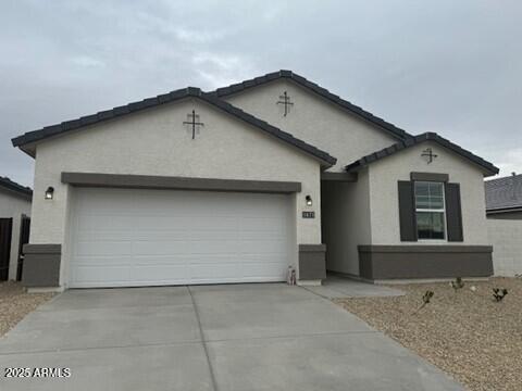 single story home featuring a garage