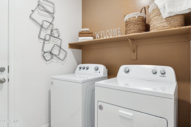 clothes washing area featuring washing machine and clothes dryer