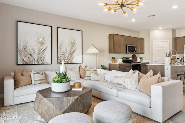 living room featuring a notable chandelier