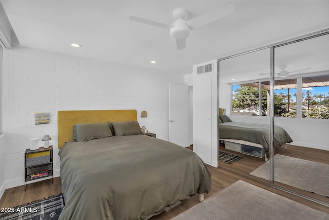 4411 N 40th St Unit 59, Phoenix, AZ 85018 - bedroom featuring wood finished floors, baseboards, ceiling fan, and a closet