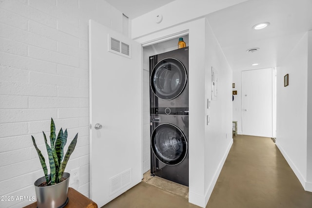 4411 N 40th St Unit 59, Phoenix, AZ 85018 - clothes washing area with stacked washer / drying machine and baseboards