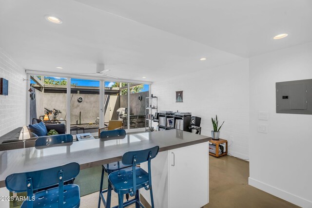 4411 N 40th St Unit 59, Phoenix, AZ 85018 - kitchen with electric panel, finished concrete flooring, healthy amount of natural light, recessed lighting, and baseboards