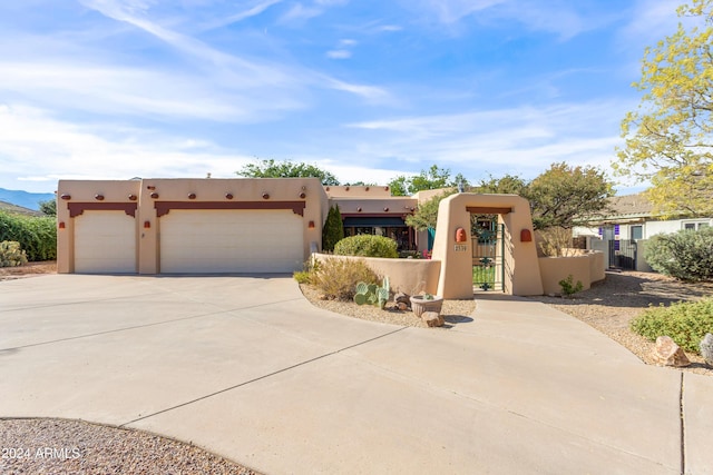 adobe home featuring a garage