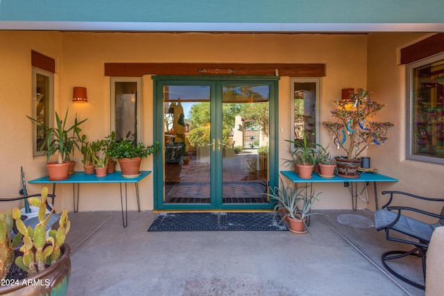 property entrance featuring a patio