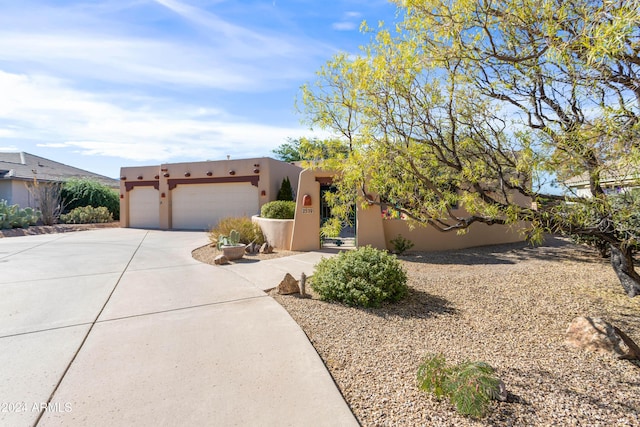 southwest-style home with a garage