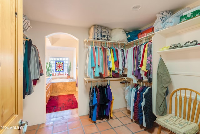 spacious closet featuring light tile patterned flooring