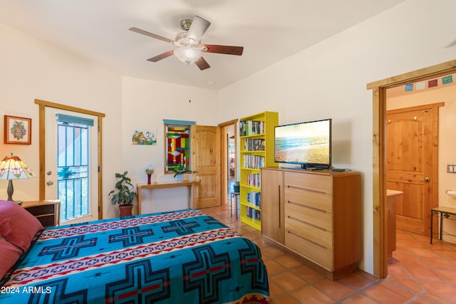 tiled bedroom featuring ceiling fan