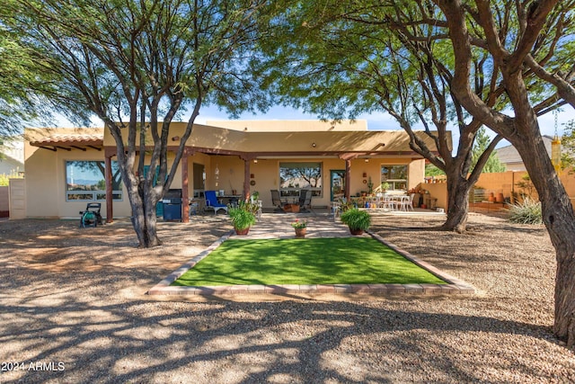 back of property with a patio area