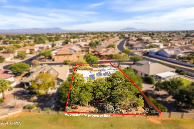 birds eye view of property featuring a mountain view