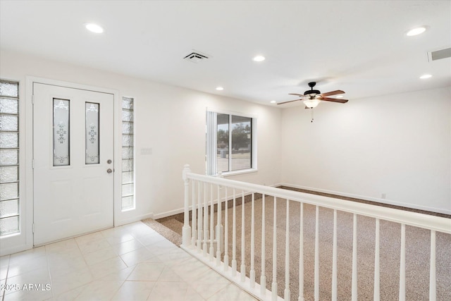 entrance foyer with ceiling fan