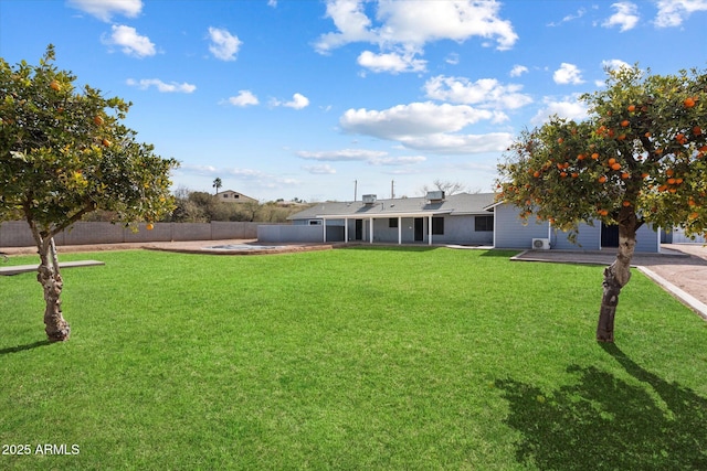 view of front of property with a patio and a front lawn