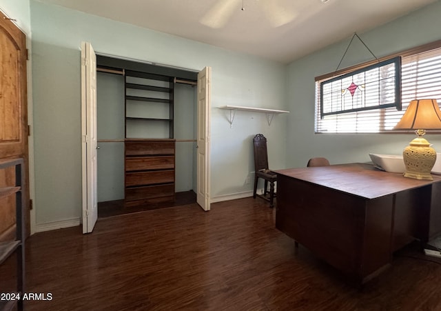 office space with baseboards, wood finished floors, and a ceiling fan