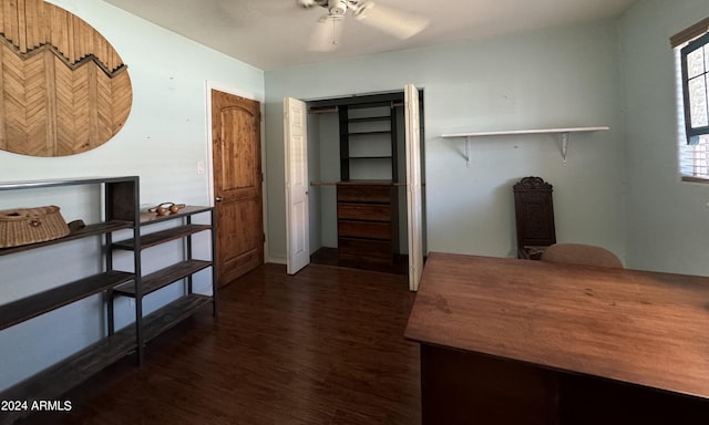 home office with dark wood finished floors and a ceiling fan