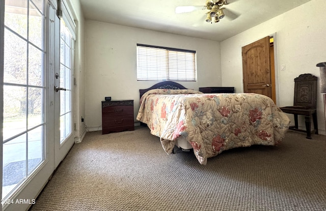 bedroom featuring carpet flooring, multiple windows, and ceiling fan