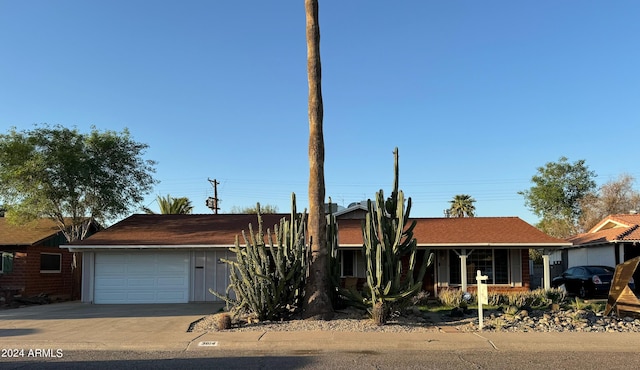 single story home with a garage