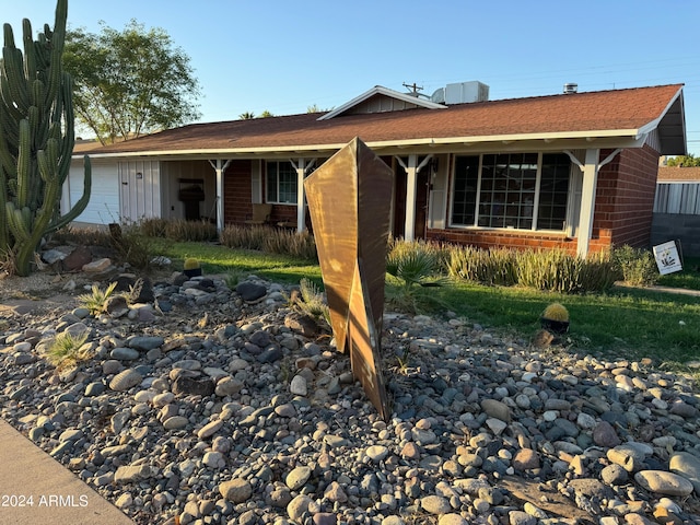 ranch-style house with brick siding