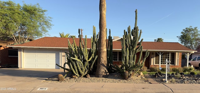 view of front of property with concrete driveway