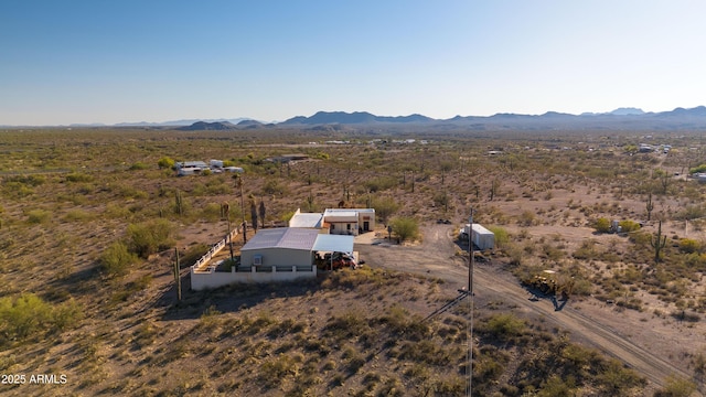 aerial view of sparsely populated area featuring a mountainous background