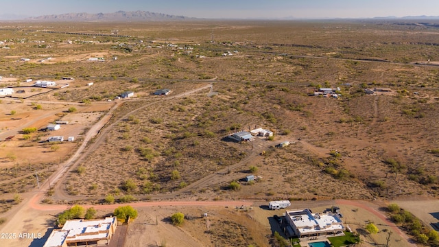 aerial view of property's location with a desert landscape and rural landscape