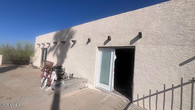 view of side of property with stucco siding