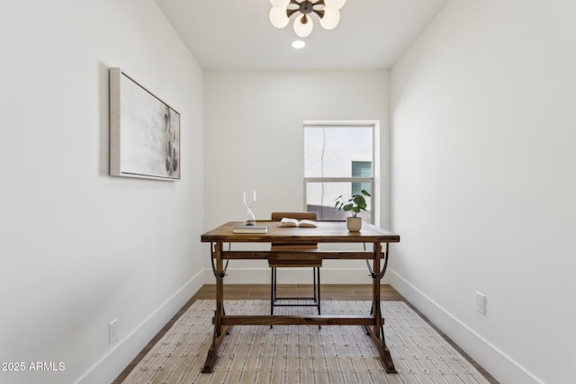 office space featuring an inviting chandelier