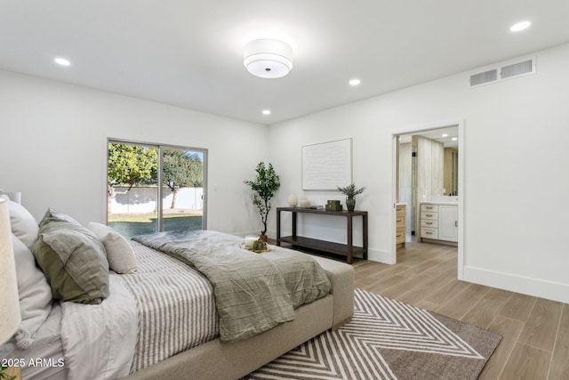 bedroom featuring access to outside and ensuite bath