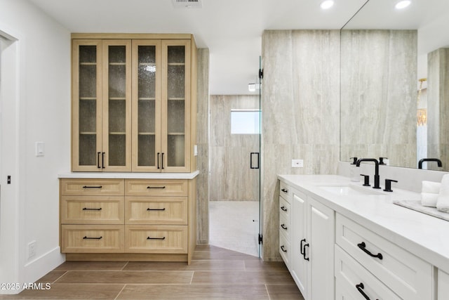 bathroom featuring vanity and walk in shower