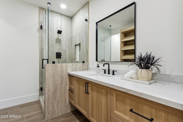 bathroom with vanity and an enclosed shower