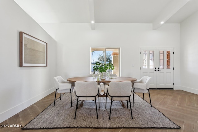 dining area with beam ceiling