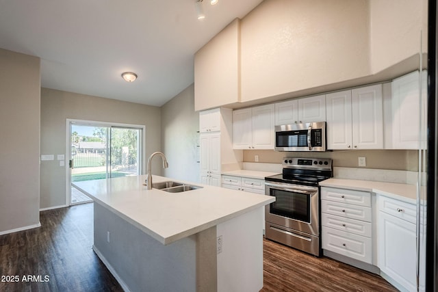 1227 E Sheena Dr, Phoenix, AZ 85022 - kitchen with appliances with stainless steel finishes, a sink, vaulted ceiling, dark wood-style flooring, and white cabinets