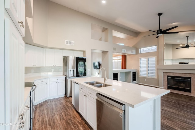 1227 E Sheena Dr, Phoenix, AZ 85022 - kitchen with appliances with stainless steel finishes, a sink, open floor plan, ceiling fan, and light countertops