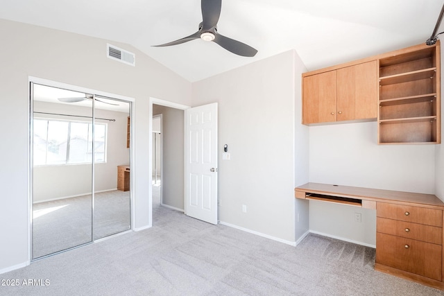 1227 E Sheena Dr, Phoenix, AZ 85022 - unfurnished office featuring a ceiling fan, built in desk, light colored carpet, and vaulted ceiling