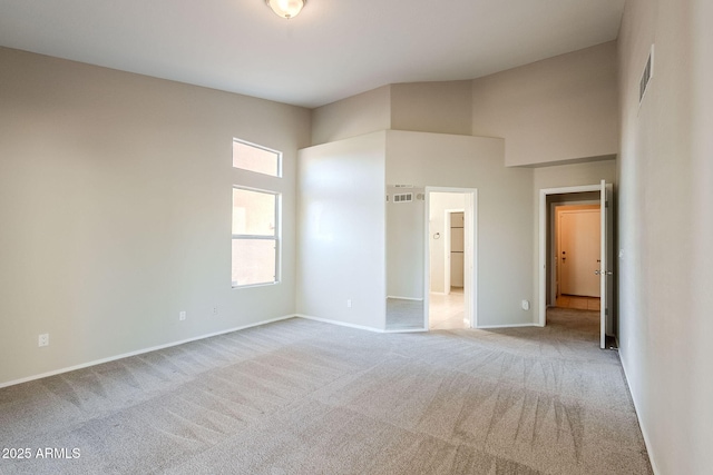 1227 E Sheena Dr, Phoenix, AZ 85022 - unfurnished bedroom with carpet floors, baseboards, and a towering ceiling