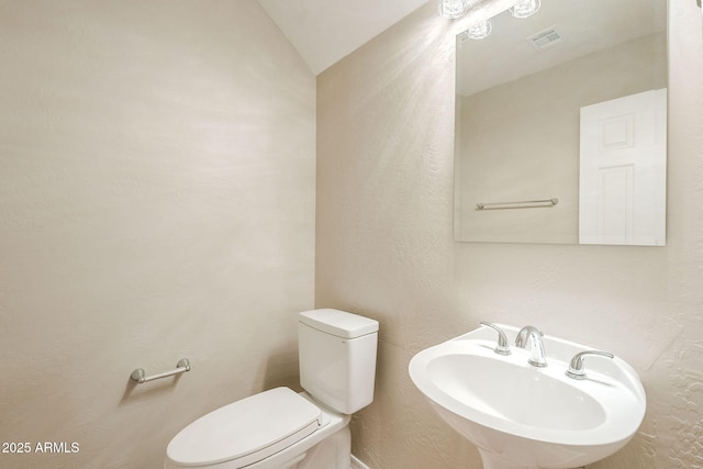 1227 E Sheena Dr, Phoenix, AZ 85022 - bathroom with a sink, toilet, and a textured wall