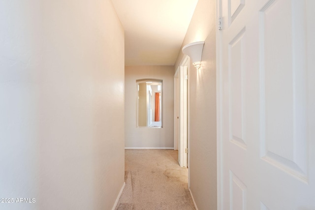 1227 E Sheena Dr, Phoenix, AZ 85022 - hallway featuring carpet floors, baseboards, and arched walkways