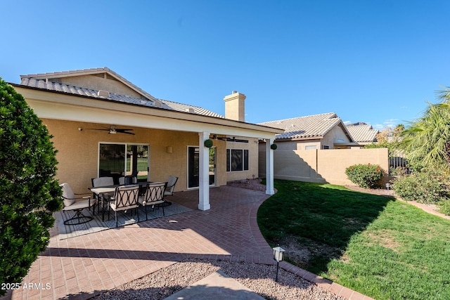 1227 E Sheena Dr, Phoenix, AZ 85022 - back of property featuring a ceiling fan, stucco siding, a chimney, and a patio area
