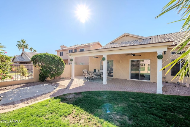 1227 E Sheena Dr, Phoenix, AZ 85022 - rear view of property featuring ceiling fan, stucco siding, and a patio area