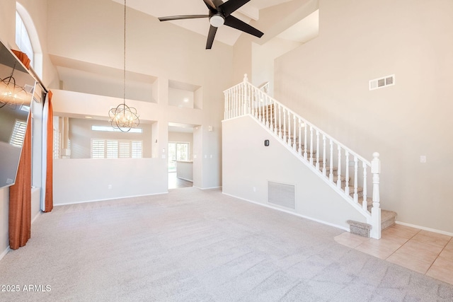 1227 E Sheena Dr, Phoenix, AZ 85022 - unfurnished living room with carpet, stairway, baseboards, ceiling fan, and a high ceiling