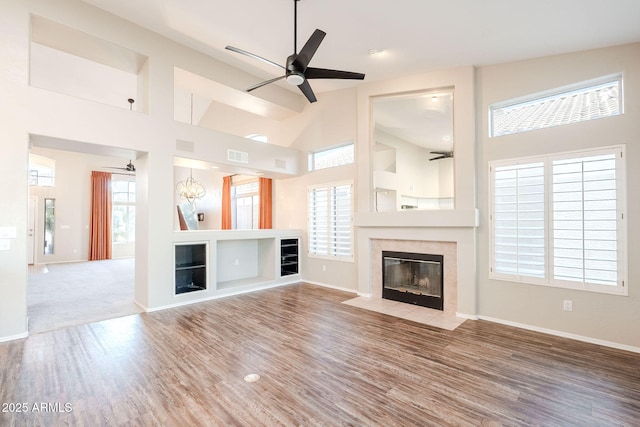 1227 E Sheena Dr, Phoenix, AZ 85022 - unfurnished living room with a tile fireplace, ceiling fan, high vaulted ceiling, wood finished floors, and baseboards