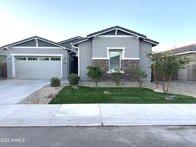 view of front of home featuring a garage and a front yard