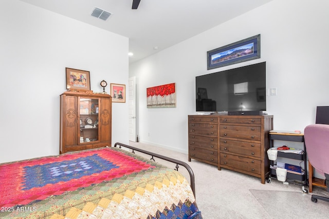 bedroom with light carpet and ceiling fan